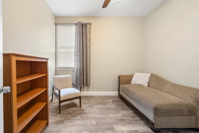a living room with furniture and a rug