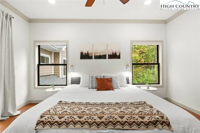 a bathroom with a granite countertop sink a mirror and shower