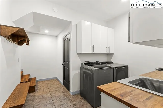 a kitchen with a stove a refrigerator and a microwave