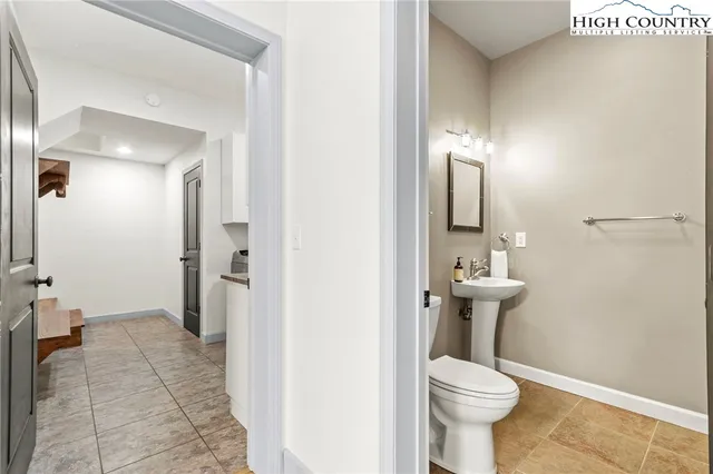 a living room with a couch and a stove top oven