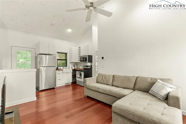 a bathroom with a sink a mirror a toilet and a shower