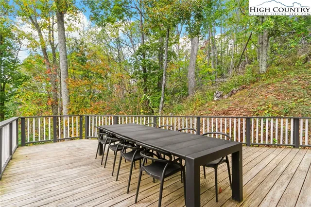 view of a house with a yard and a tree
