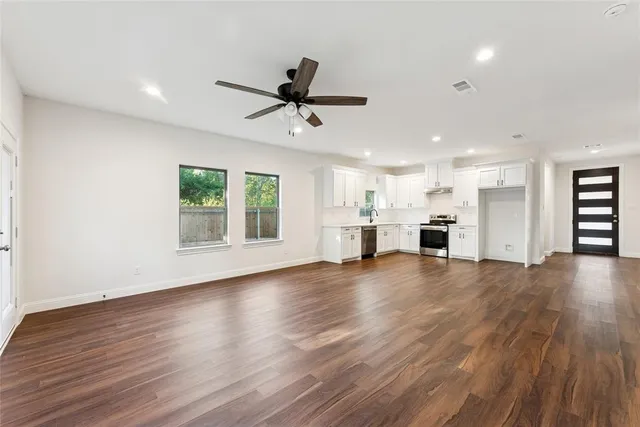a view of a kitchen with a sink and a window