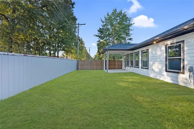 front view of a house with a garden