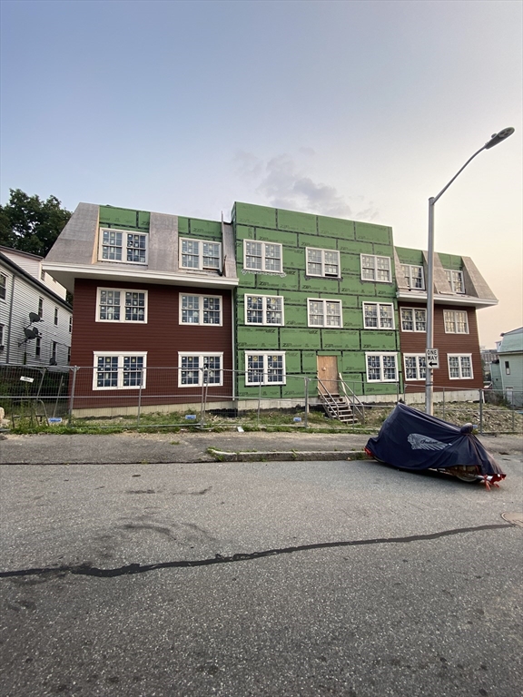 111 Austin Street Worcester, MA 01609 - Photo 1 of 4 a car parked in front of a brick building