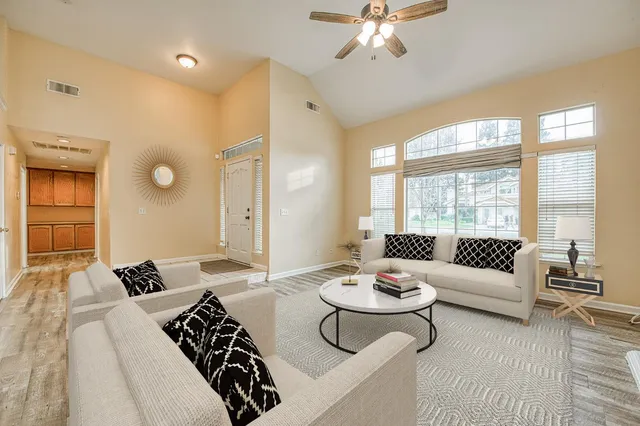 a living room with furniture and a large window