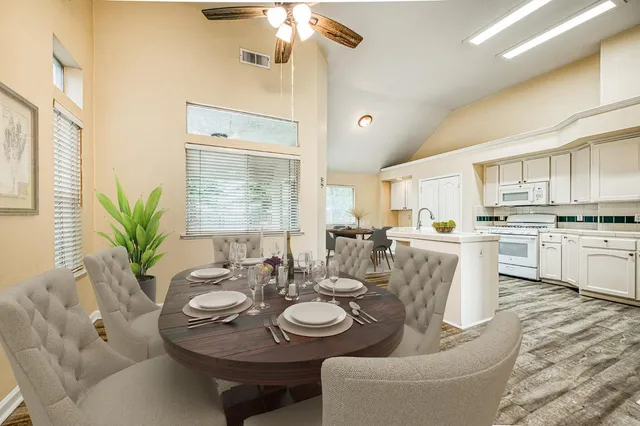 a view of a dining room with furniture and wooden floor