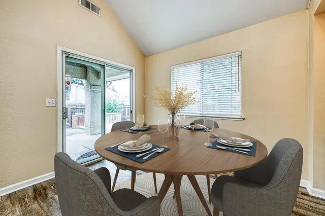 a view of a dining room and livingroom with furniture