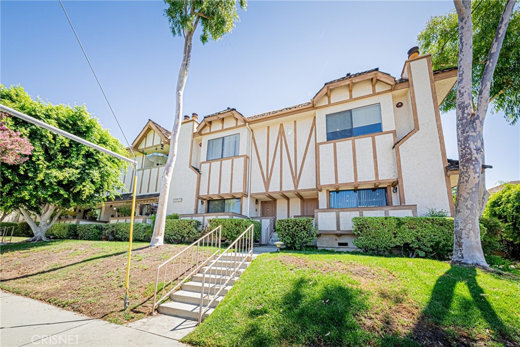 10338 Zelzah Avenue, Unit 1 Northridge, CA 91325 - Photo 1 of 44 a view of a street with a building in the background