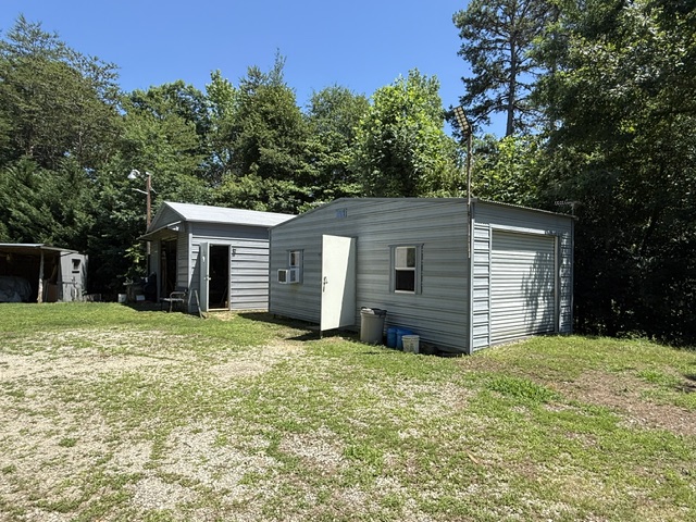 731 Glenn Ferry Road Fair Play, SC 29643 - Photo 12 of 23 Two versatile outbuildings offer ample storage and workspace on a sprawling, green property.