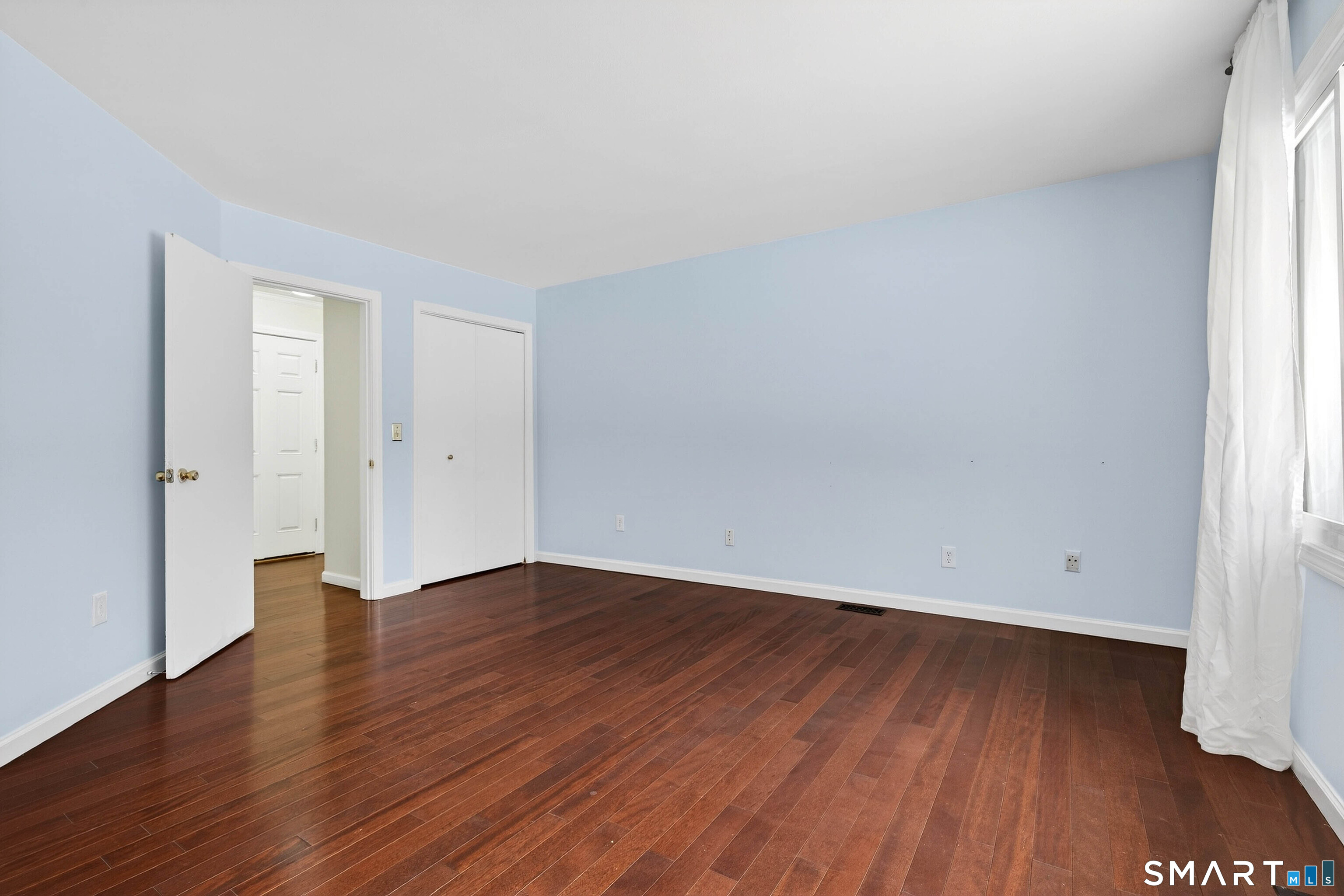 449 Lantern Hill Road Stonington, CT 06355 - Photo 12 of 40 an empty room with wooden floor