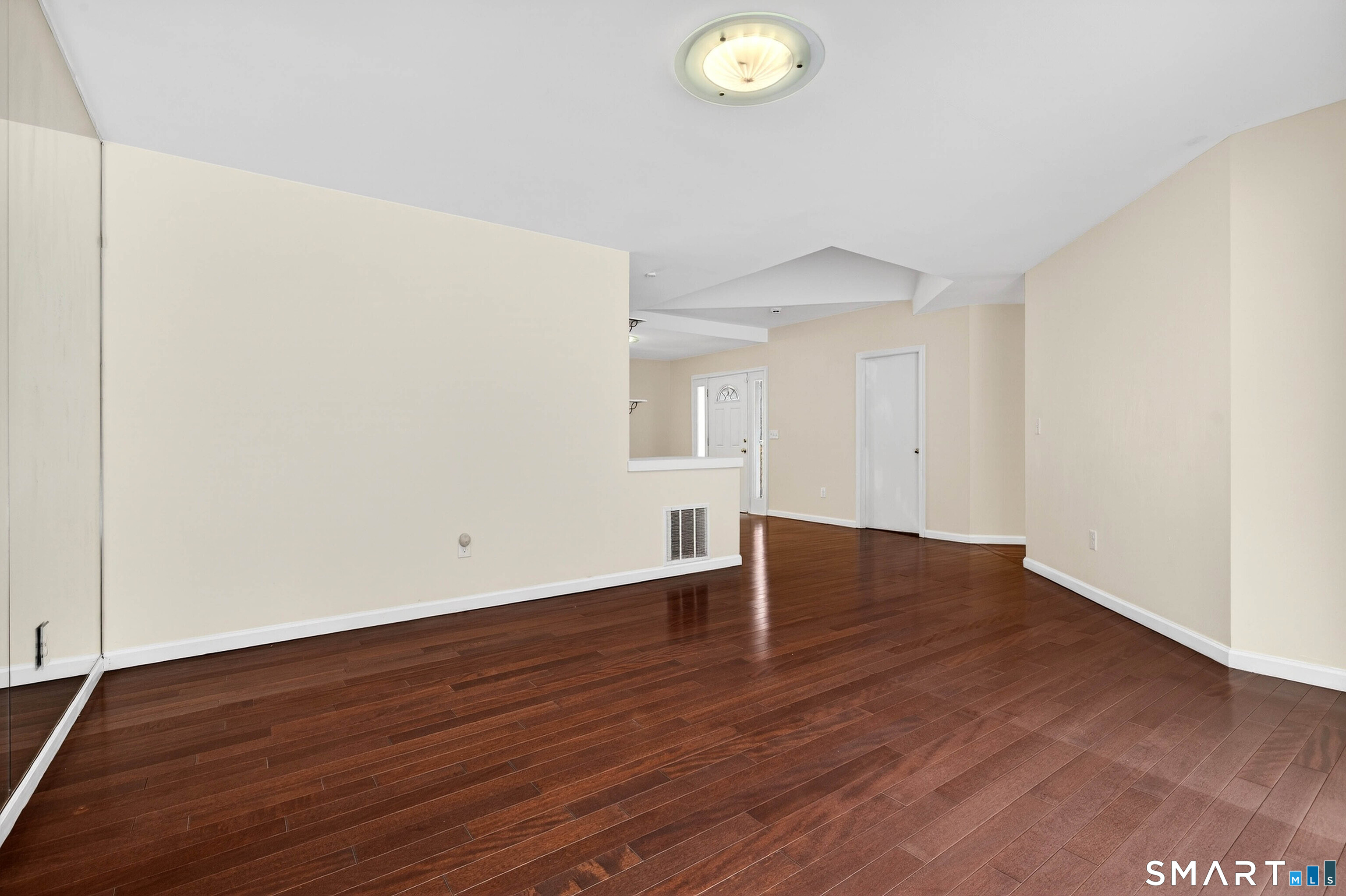 449 Lantern Hill Road Stonington, CT 06355 - Photo 15 of 40 an empty room with wooden floor and window