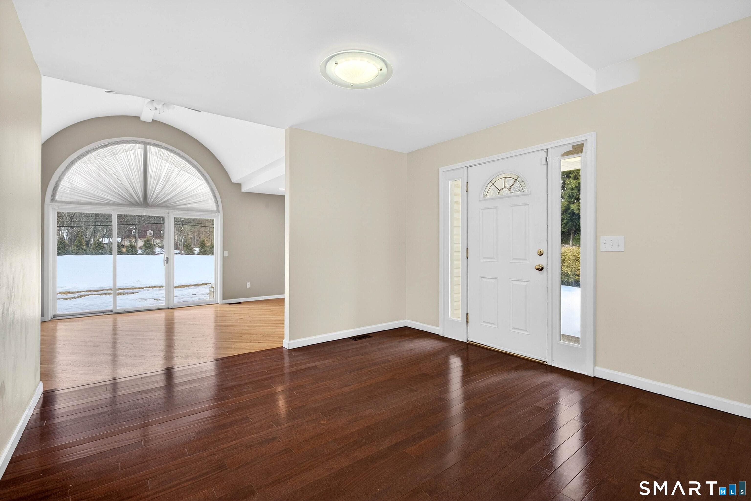 449 Lantern Hill Road Stonington, CT 06355 - Photo 16 of 40 an empty room with wooden floor and windows