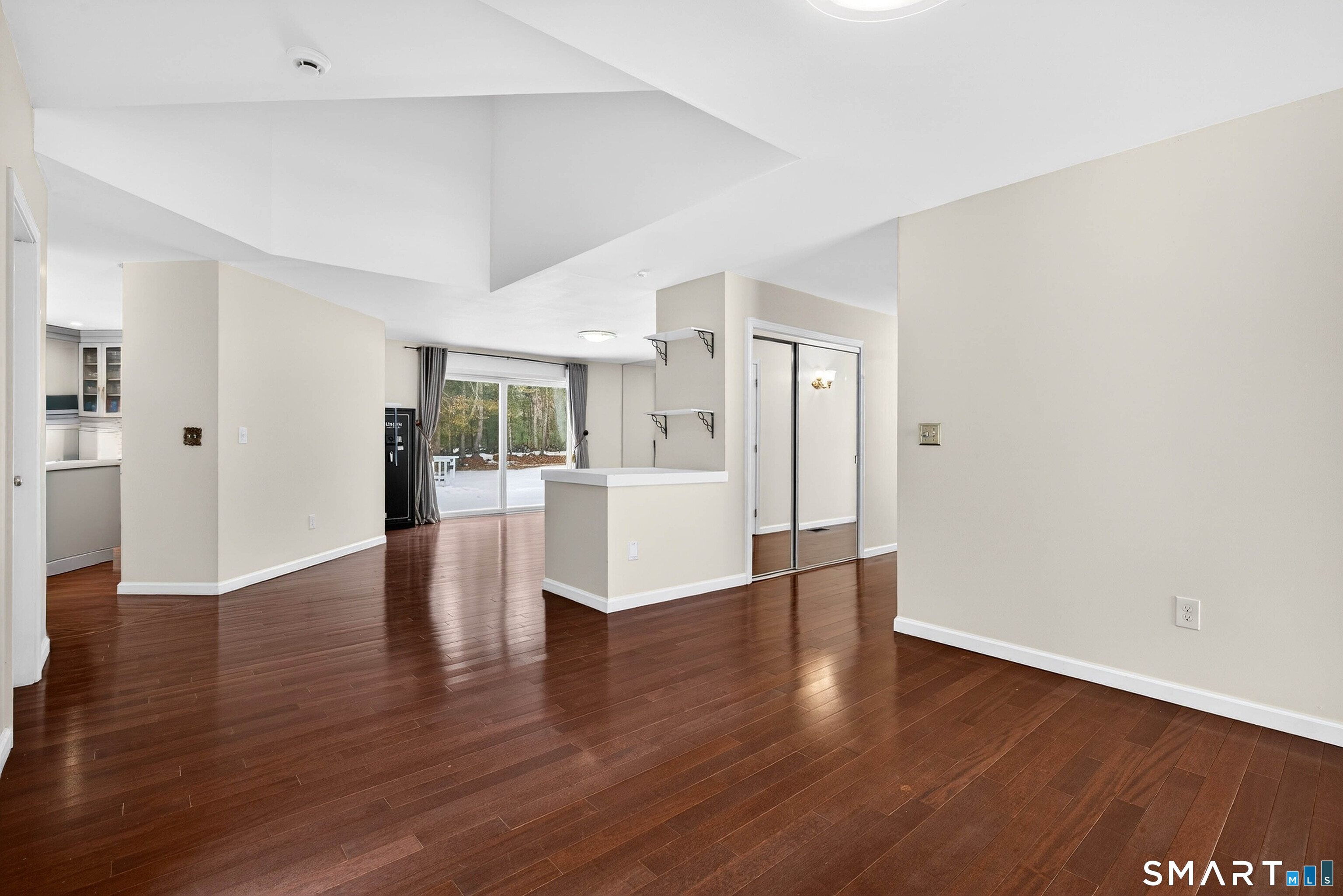 449 Lantern Hill Road Stonington, CT 06355 - Photo 17 of 40 a view of an empty room with wooden floor and a cabinet