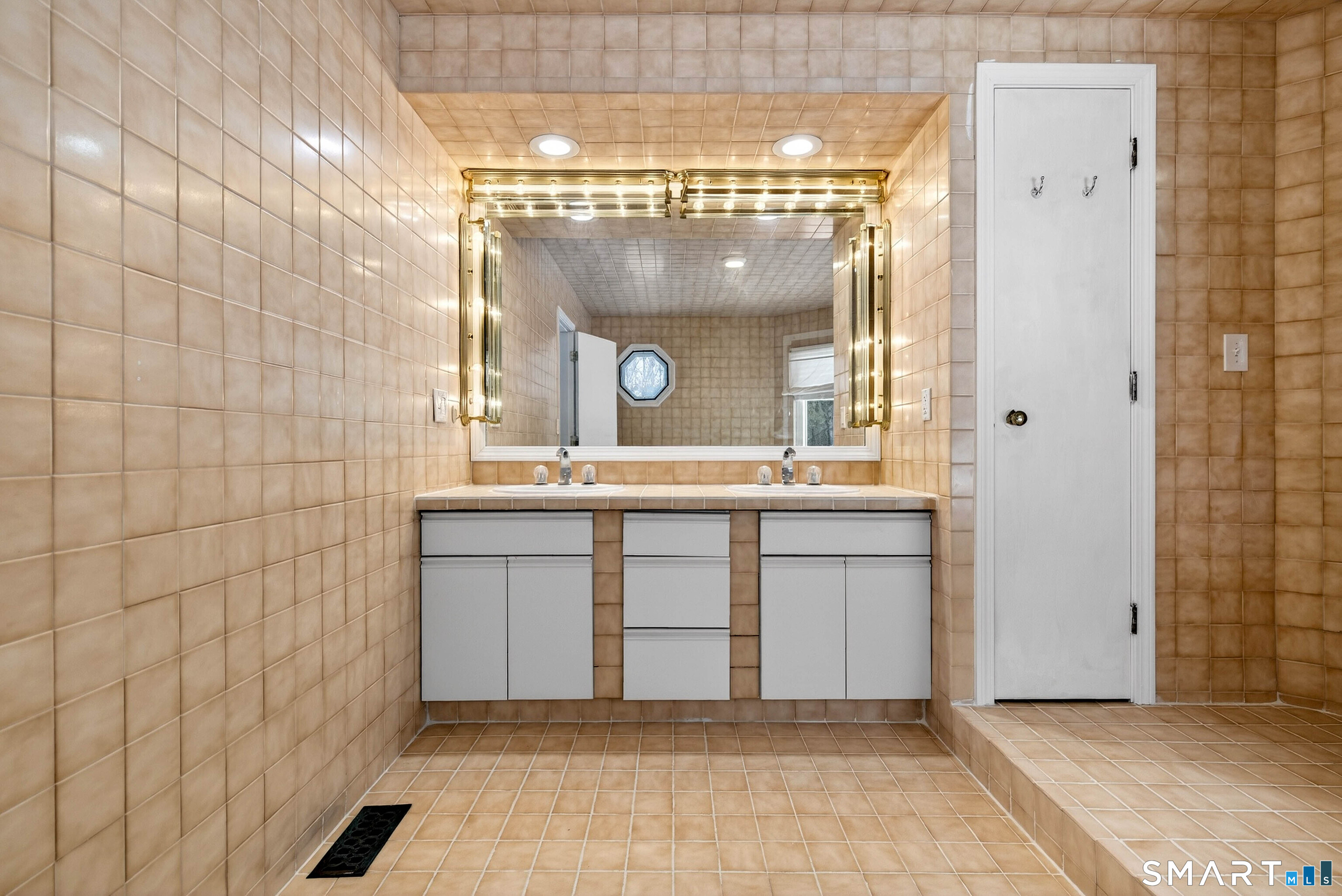 449 Lantern Hill Road Stonington, CT 06355 - Photo 21 of 40 a bathroom with a granite countertop sink mirror and a shower