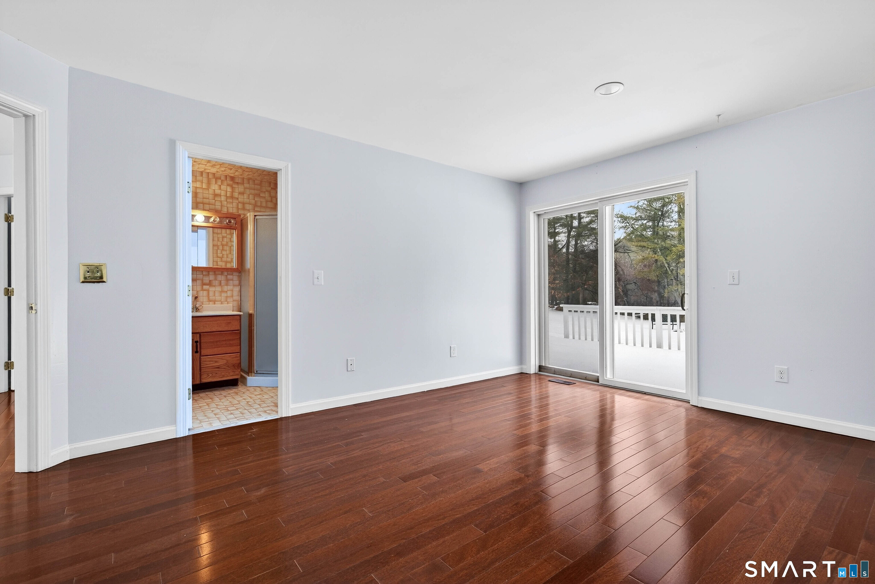 449 Lantern Hill Road Stonington, CT 06355 - Photo 24 of 40 a view of an empty room with wooden floor and a window