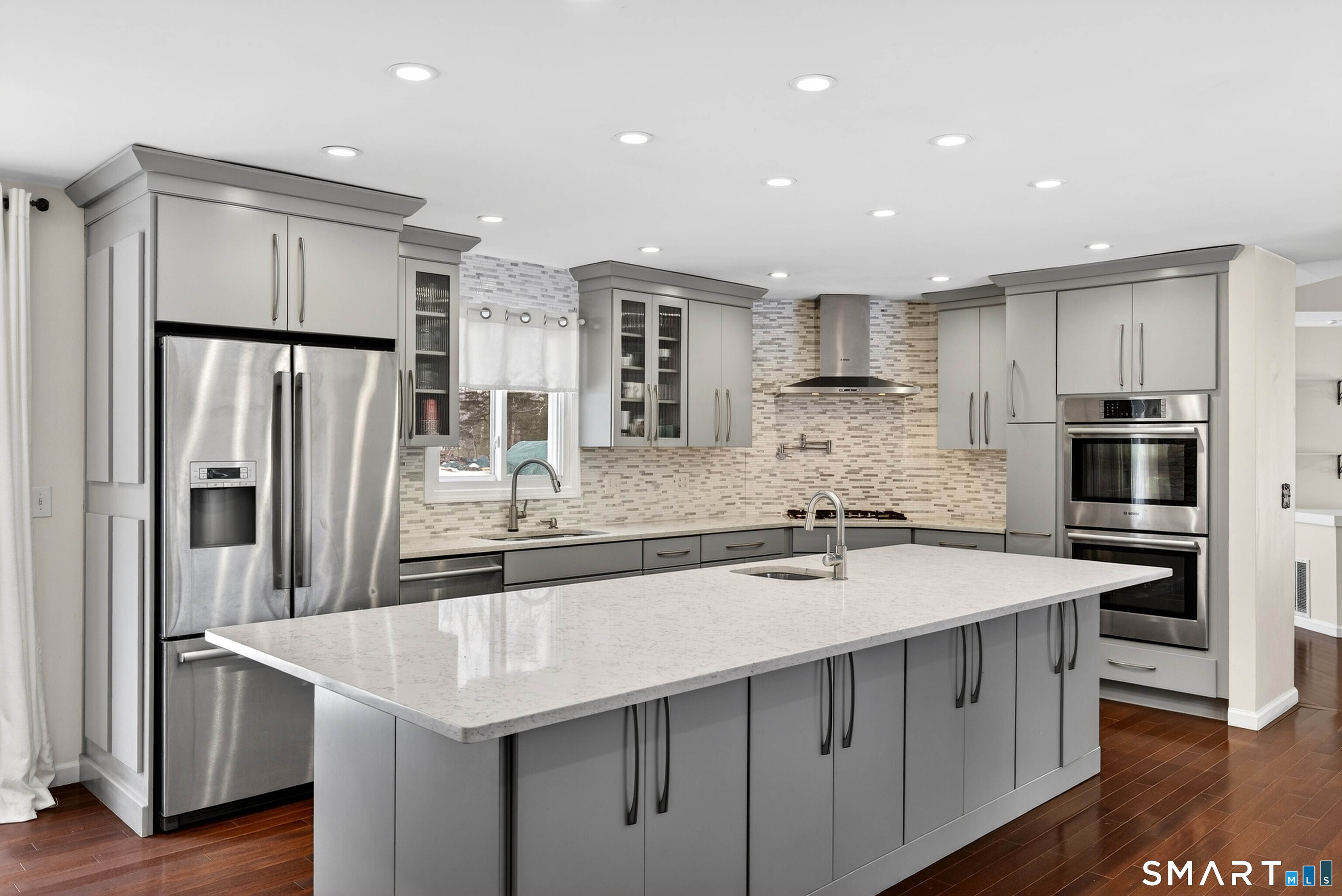 449 Lantern Hill Road Stonington, CT 06355 - Photo 26 of 40 a kitchen with stainless steel appliances a sink stove and refrigerator