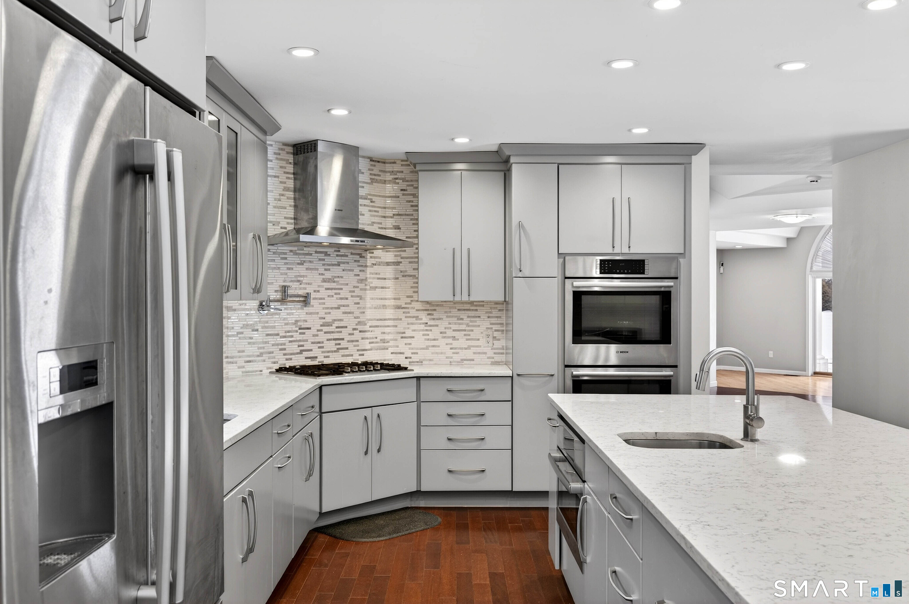 449 Lantern Hill Road Stonington, CT 06355 - Photo 30 of 40 a kitchen with stainless steel appliances granite countertop a sink stove and refrigerator
