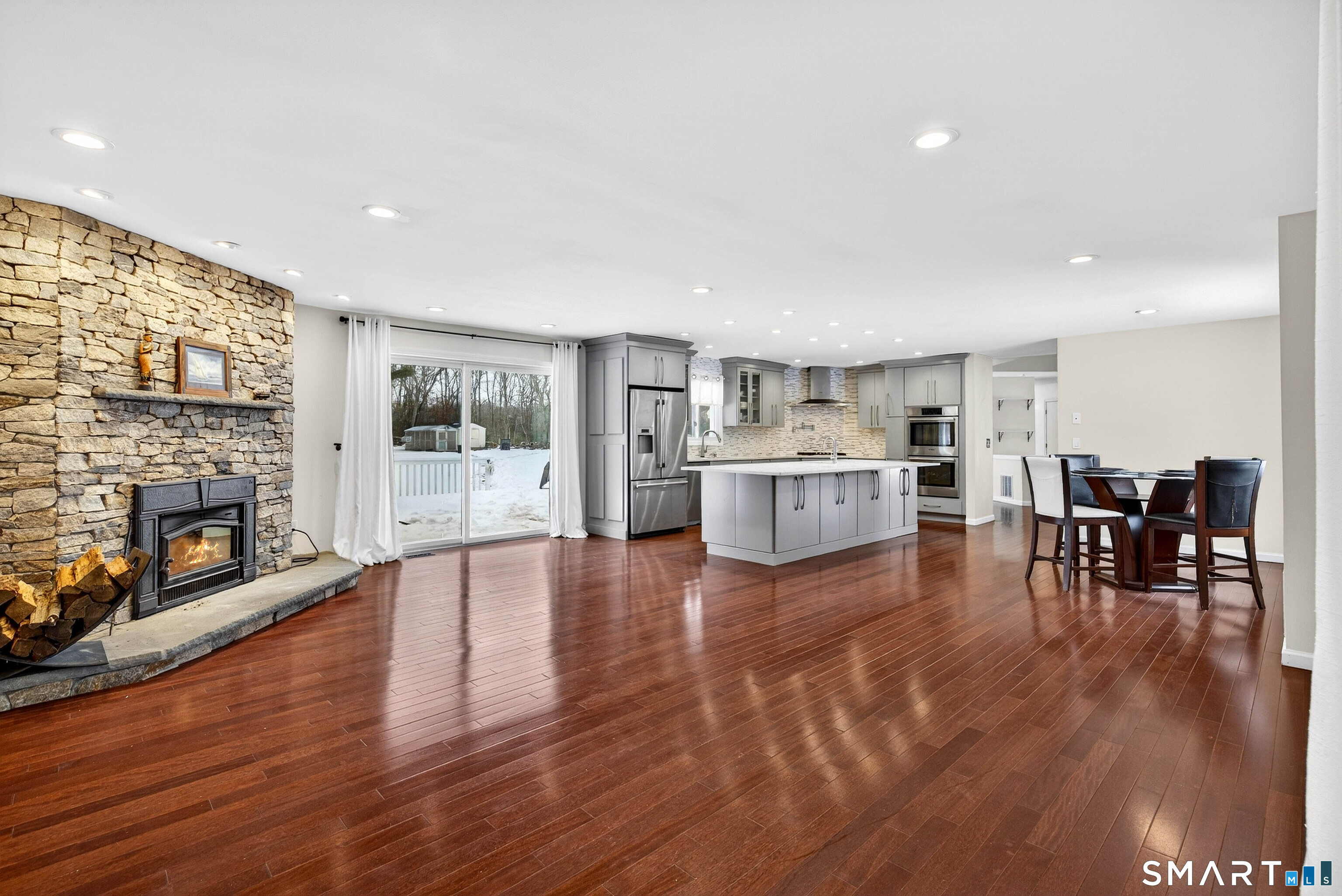 449 Lantern Hill Road Stonington, CT 06355 - Photo 32 of 40 a living room with furniture and a wooden floor