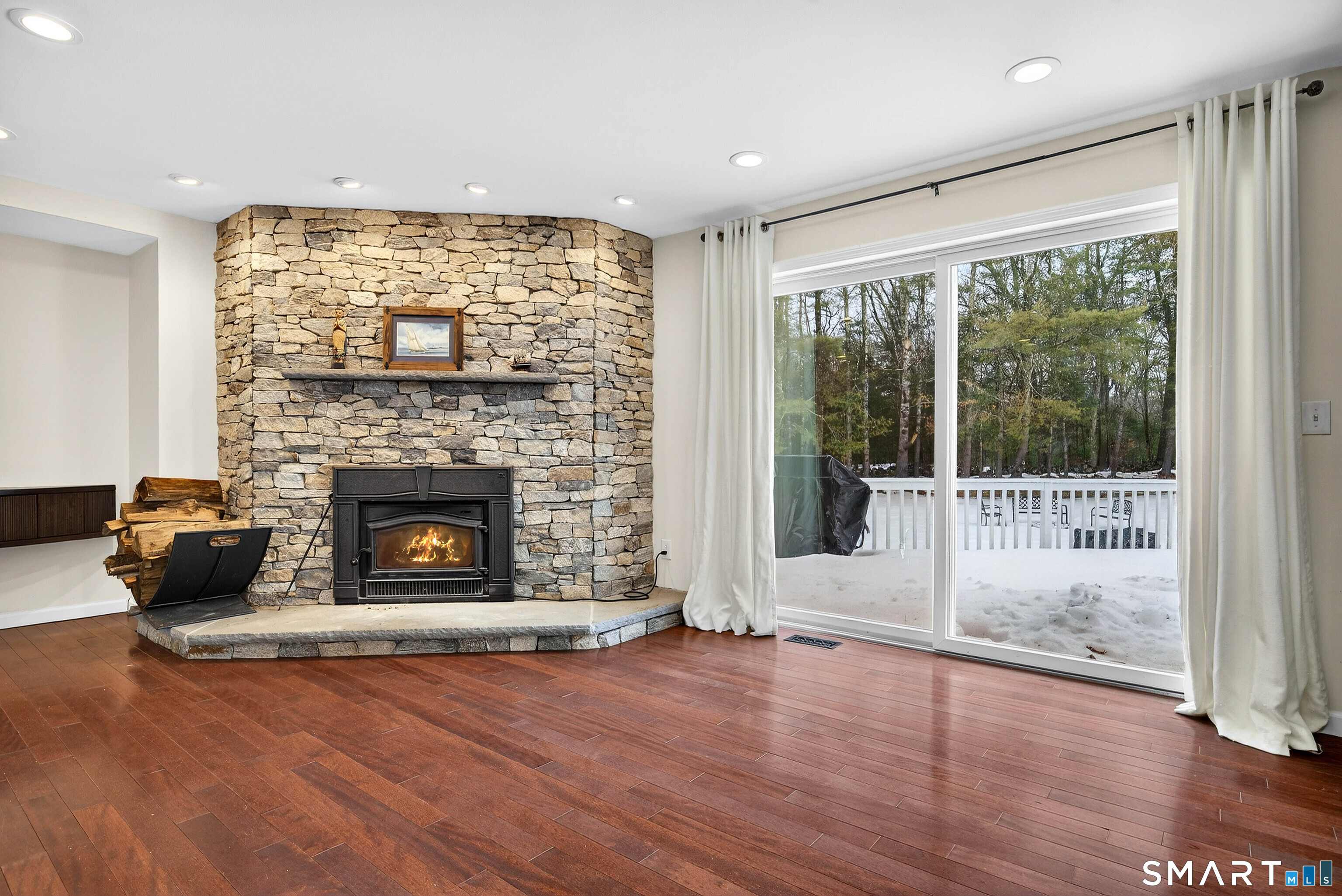 449 Lantern Hill Road Stonington, CT 06355 - Photo 33 of 40 a living room with furniture and a fireplace