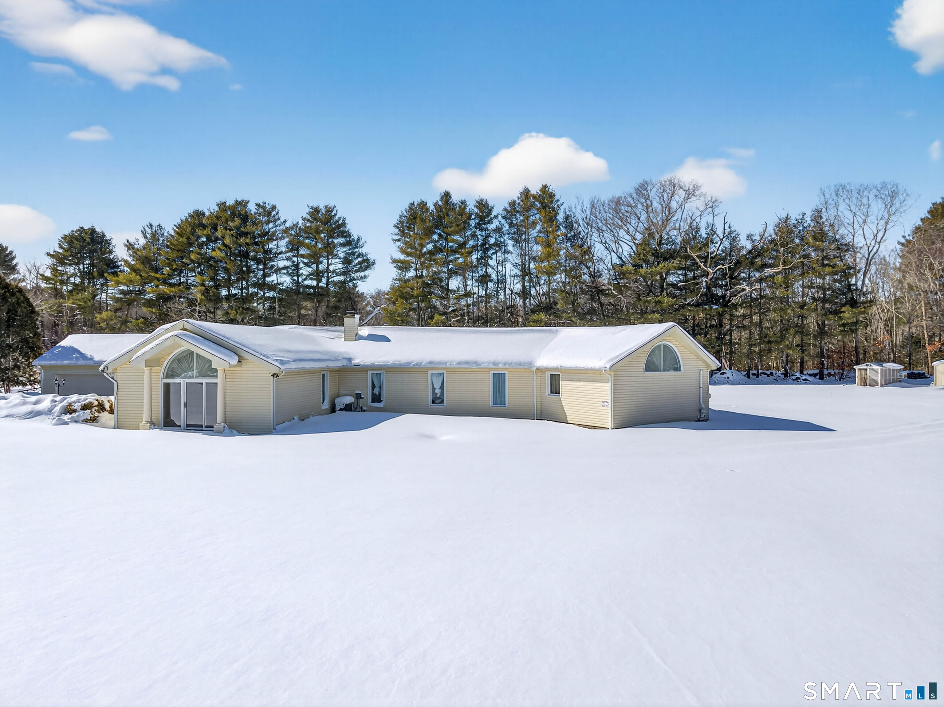 449 Lantern Hill Road Stonington, CT 06355 - Photo 39 of 40 a front view of a house with a yard and covered with snow