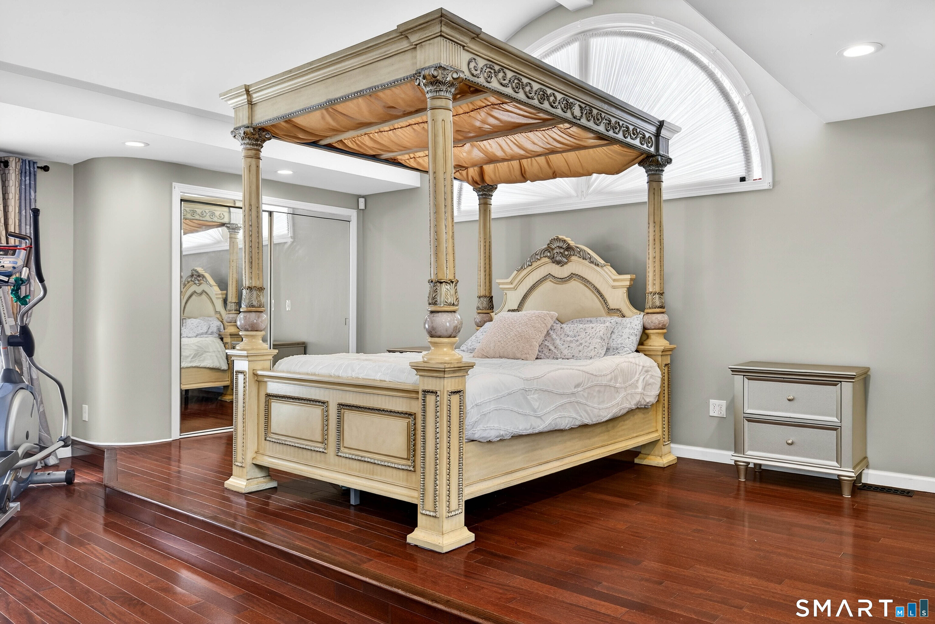 449 Lantern Hill Road Stonington, CT 06355 - Photo 8 of 40 a bedroom with a bed and a mirror