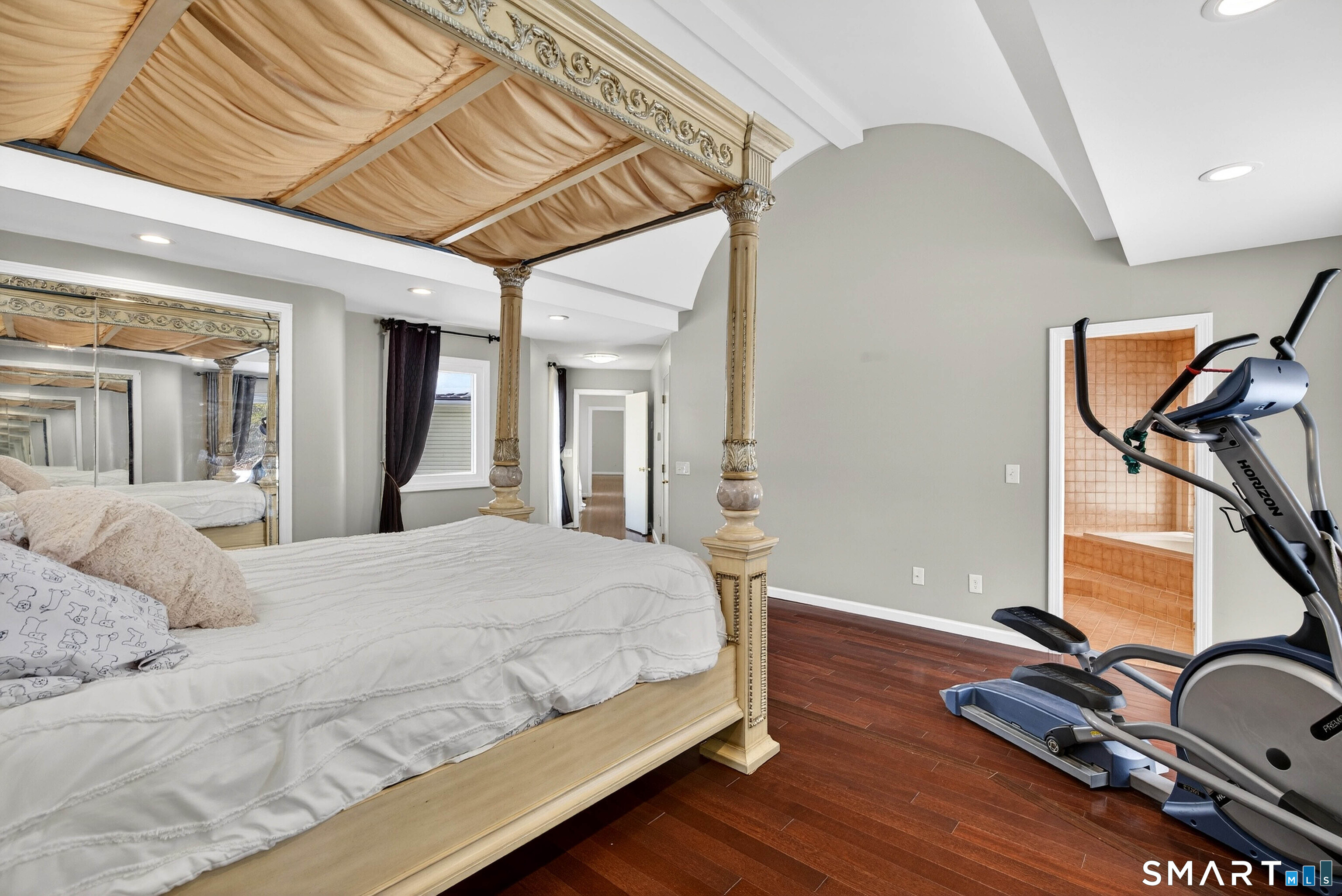 449 Lantern Hill Road Stonington, CT 06355 - Photo 10 of 40 a bedroom with a bed and wooden floor