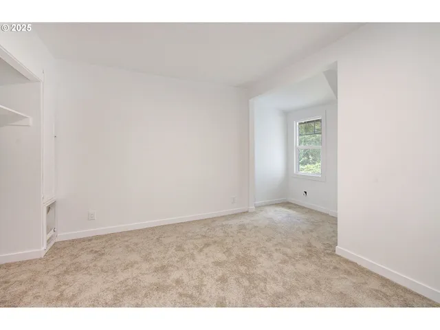 a view of an empty room and window