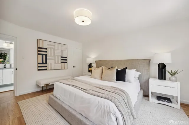 a bedroom with a bed and a couch