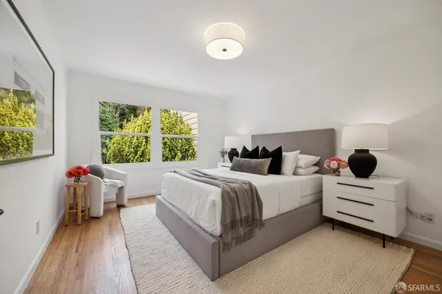 a bed room with bed and a window