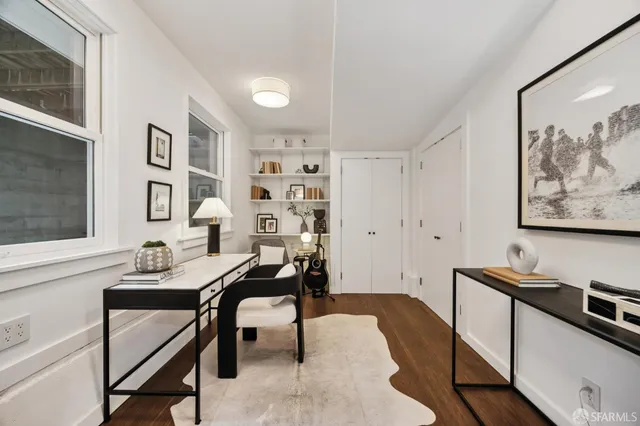 a workspace with furniture and window