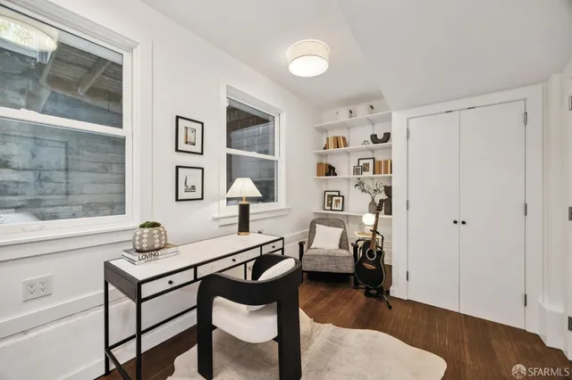 a workspace with furniture and window