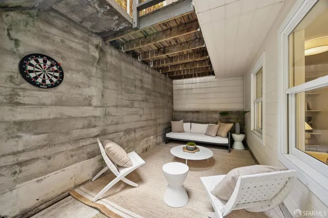 a view of a chairs and table in a patio