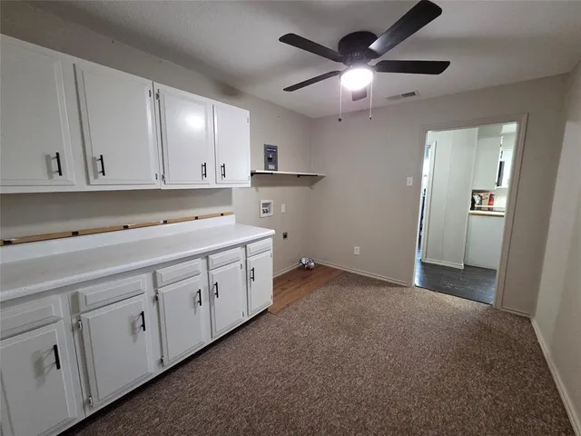 a utility room with cabinets