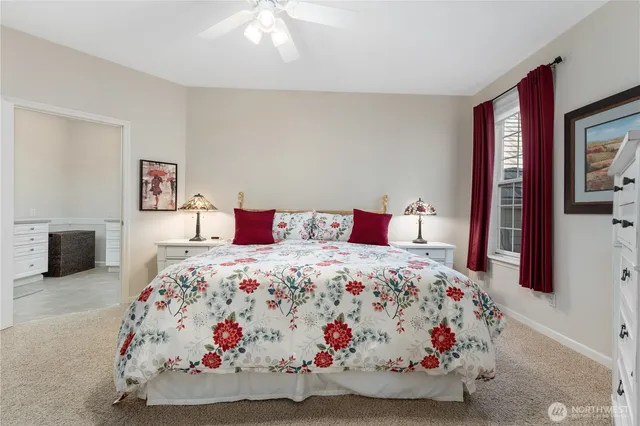 a bedroom with a bed and a couch