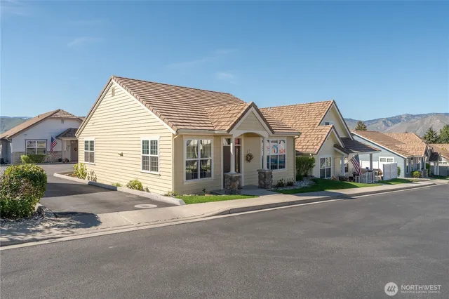 a view of a house next to a road