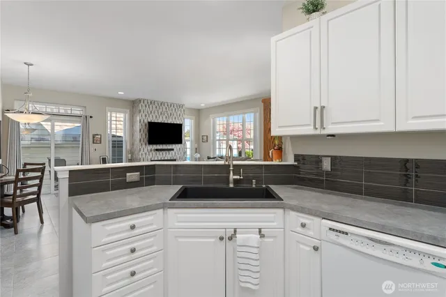 a kitchen with granite countertop a sink and a granite counter tops