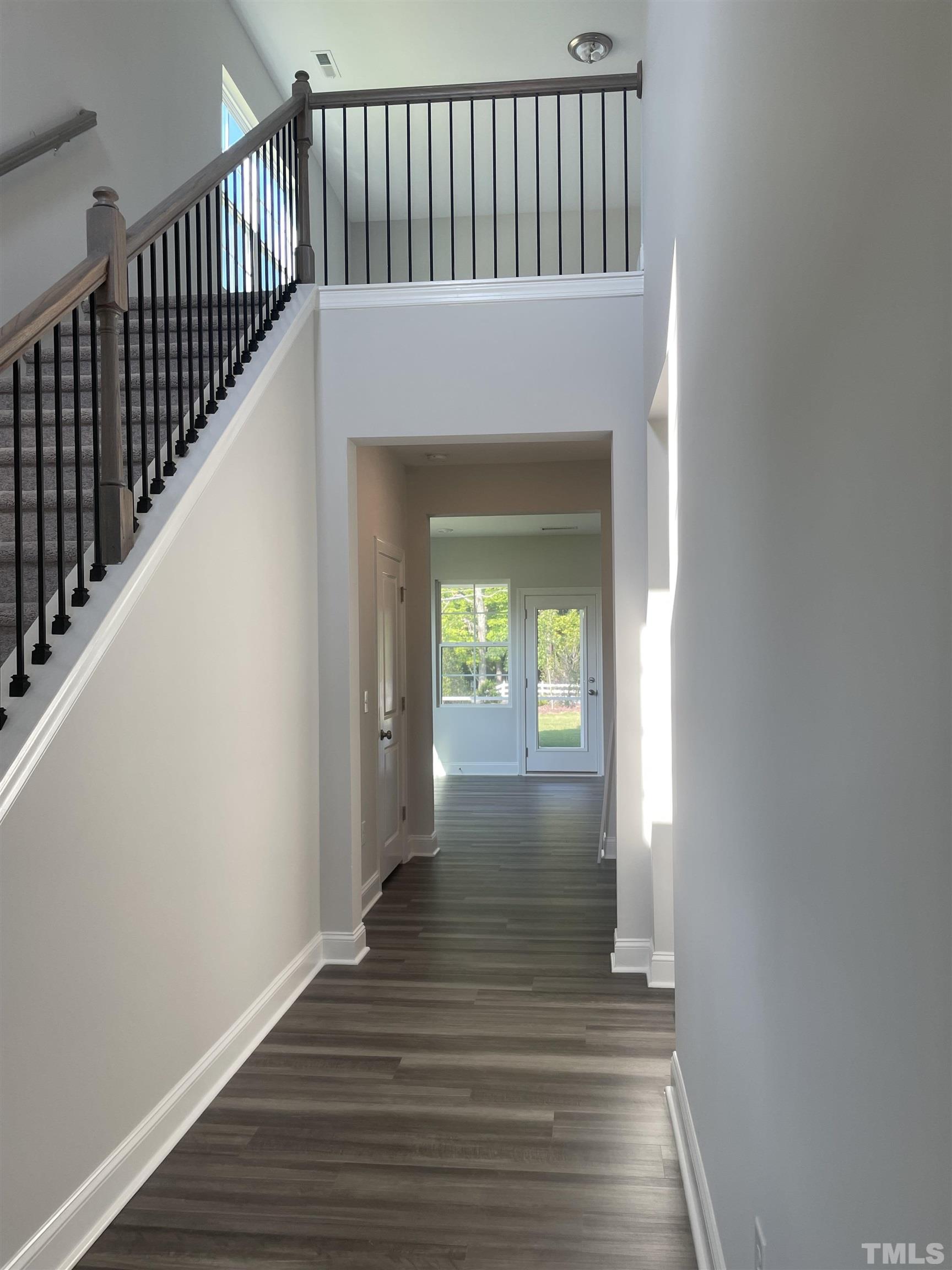 4945 Enlightenment Road, Unit 2115 Raleigh, NC 27616 - Photo 18 of 22 Photo is not actual home for sale. Photo provided to show 2 story foyer in this floorplan