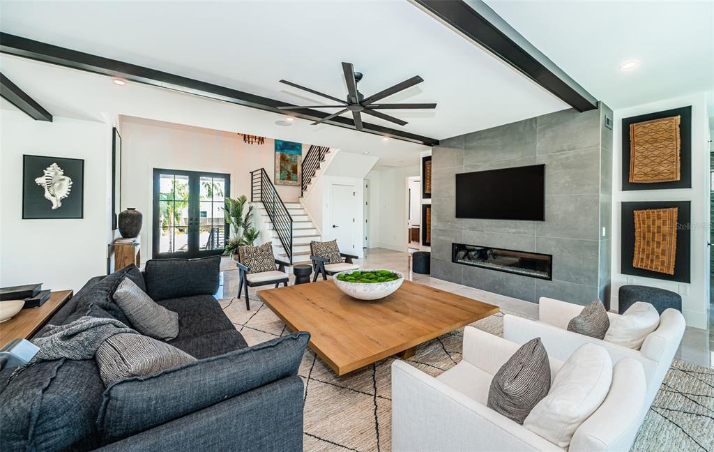 218 Sydney Lane Redington Shores, FL 33708 - Photo 11 of 100 a living room with furniture and a flat screen tv