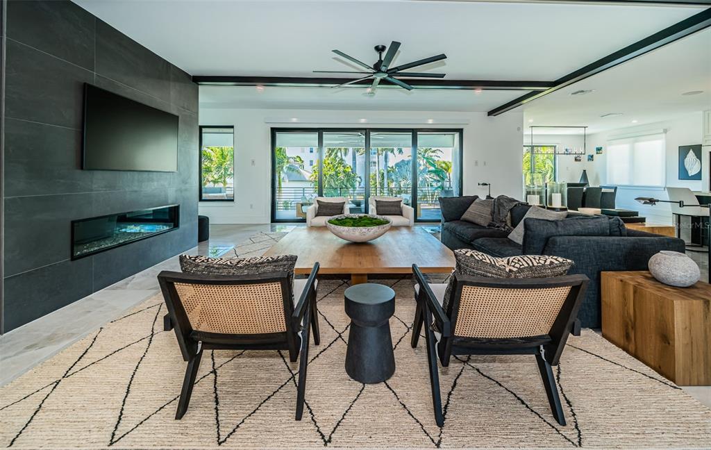 218 Sydney Lane Redington Shores, FL 33708 - Photo 13 of 100 a living room with fireplace furniture and a large window