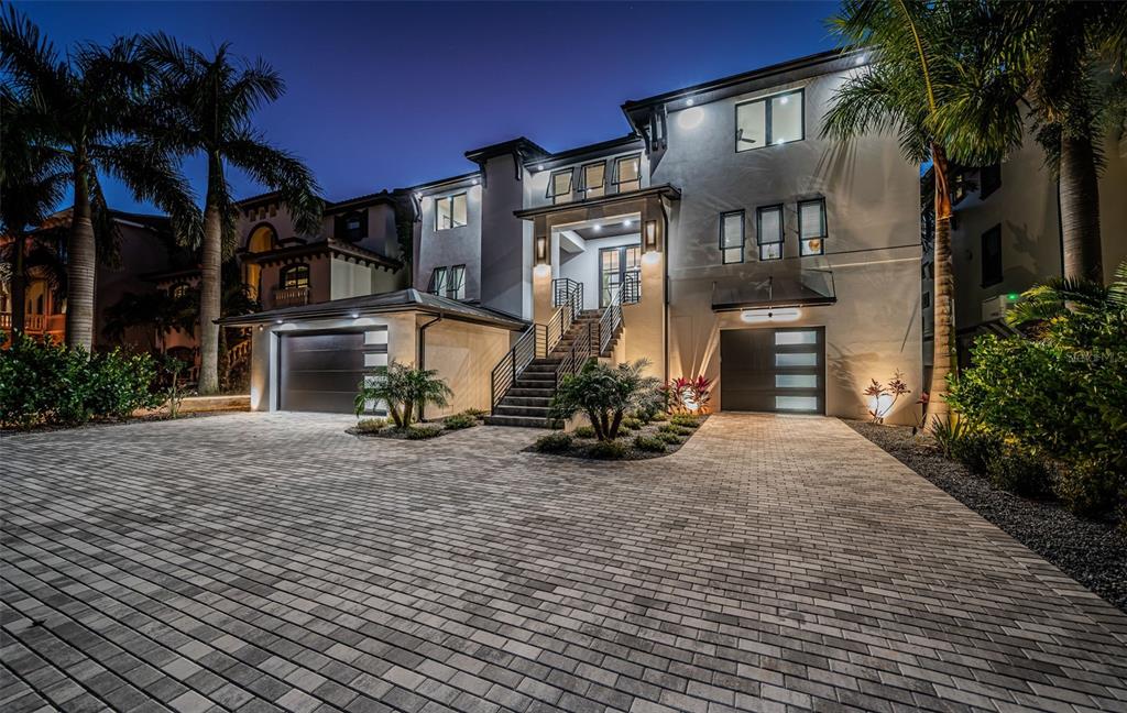 218 Sydney Lane Redington Shores, FL 33708 - Photo 2 of 100 a view of a house with a yard and garage
