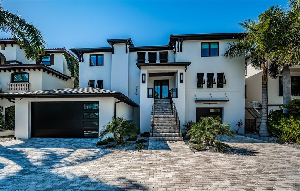218 Sydney Lane Redington Shores, FL 33708 - Photo 5 of 100 a front view of a house with a yard