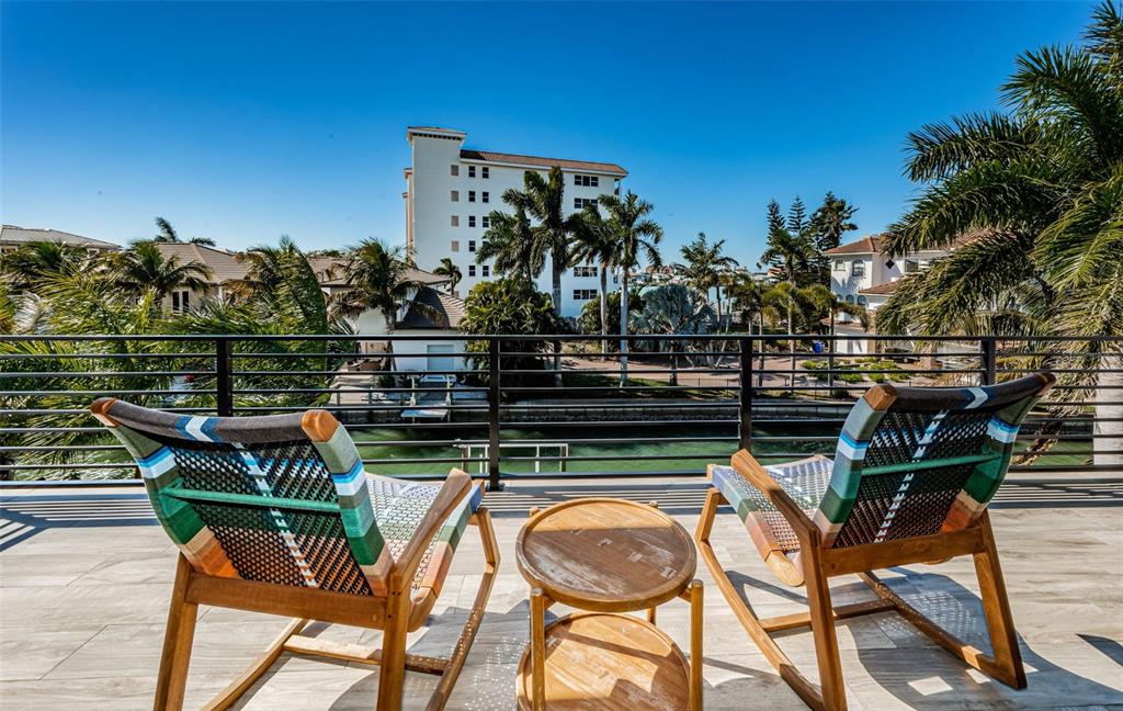 218 Sydney Lane Redington Shores, FL 33708 - Photo 57 of 100 a view of a chairs and table in patio