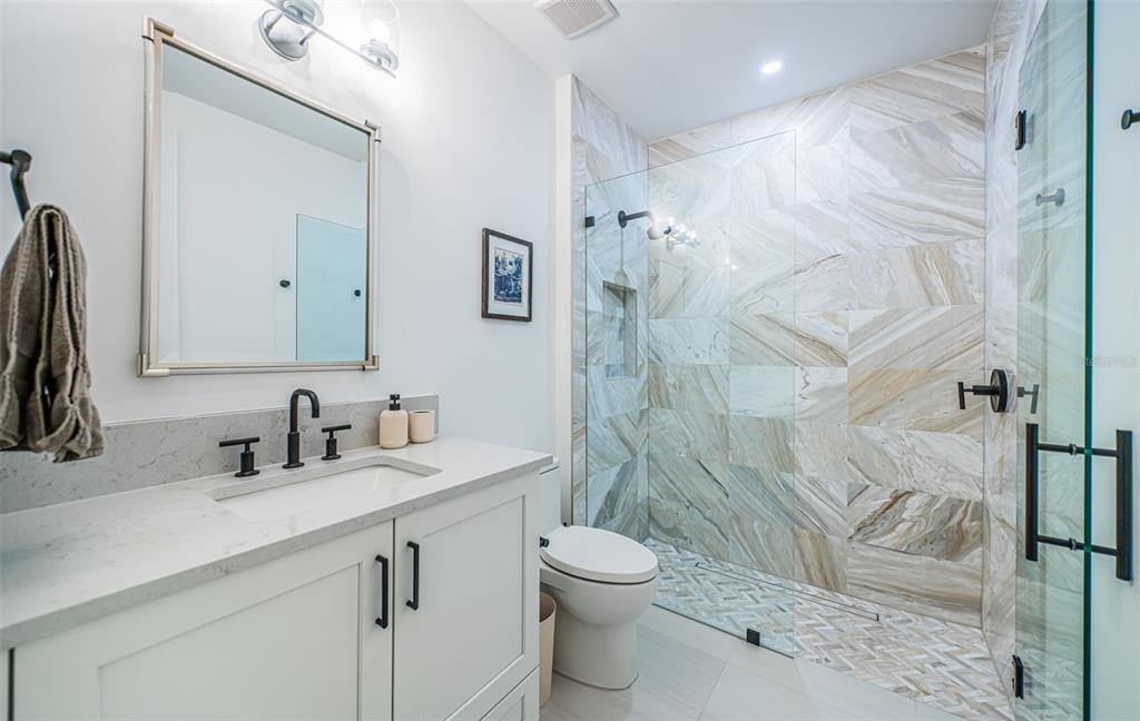 218 Sydney Lane Redington Shores, FL 33708 - Photo 79 of 100 a bathroom with a sink toilet and shower