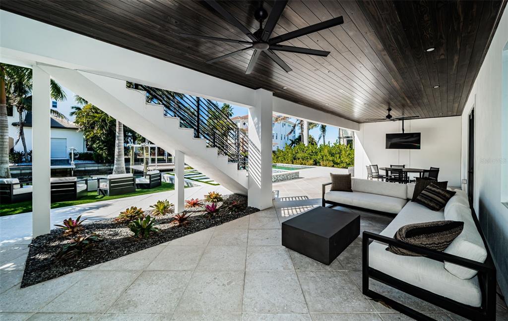 218 Sydney Lane Redington Shores, FL 33708 - Photo 86 of 100 a living room with furniture and a floor to ceiling window