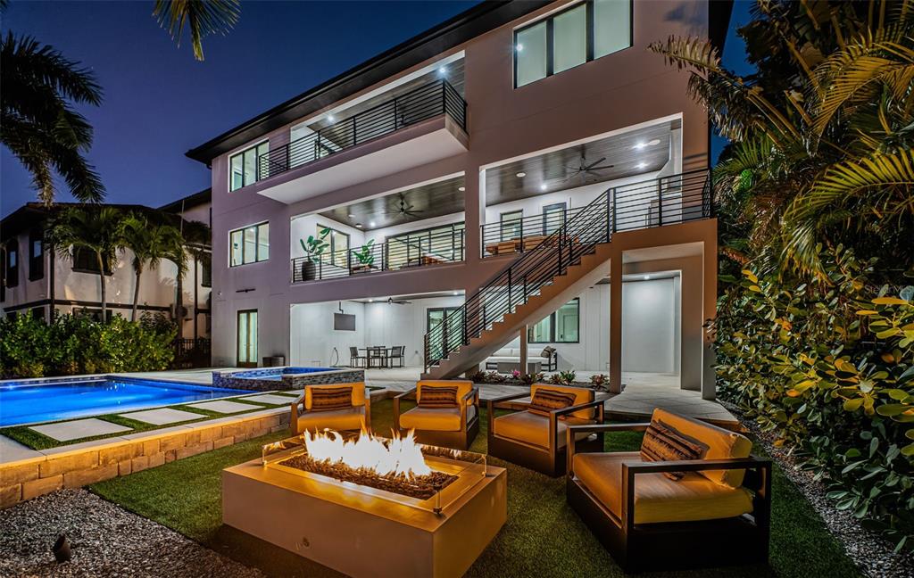 218 Sydney Lane Redington Shores, FL 33708 - Photo 95 of 100 a view of a house with swimming pool and sitting area