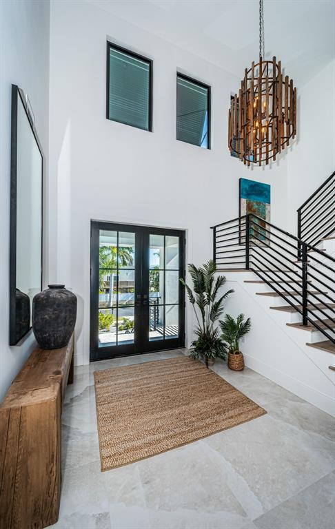 218 Sydney Lane Redington Shores, FL 33708 - Photo 10 of 100 a living room with furniture rug and a potted plant