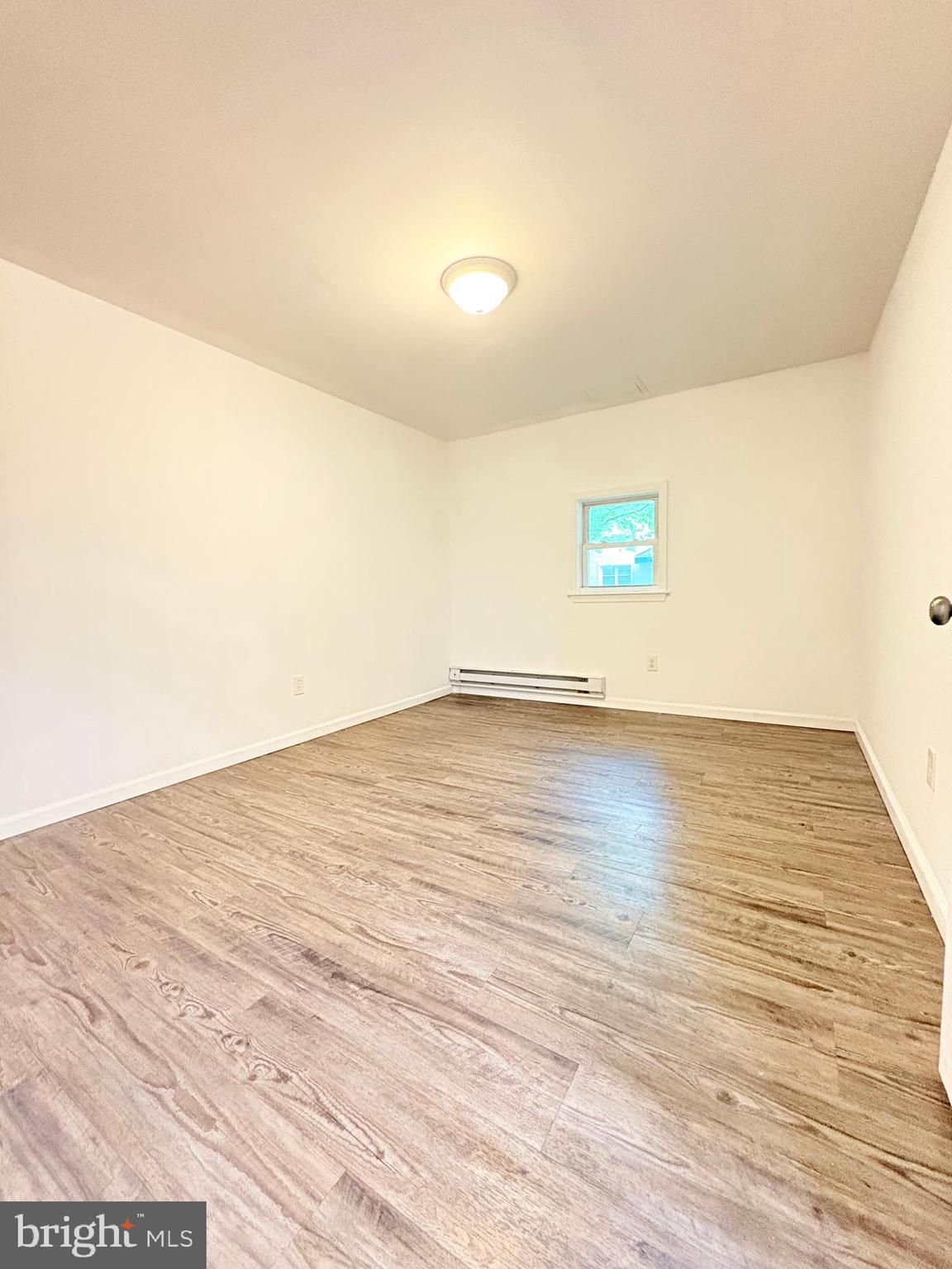 1630 East 9th Street Bethlehem, PA 18015 - Photo 4 of 17 a view of empty room with wooden floor