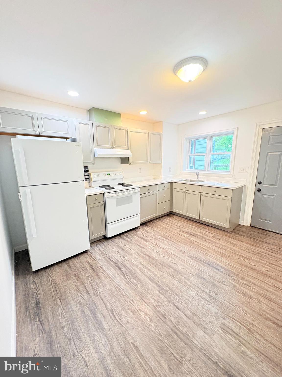 1630 East 9th Street Bethlehem, PA 18015 - Photo 8 of 17 a kitchen with a cabinets and wooden floor