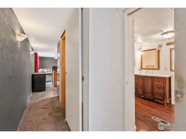 a view of a hallway with washer and dryer